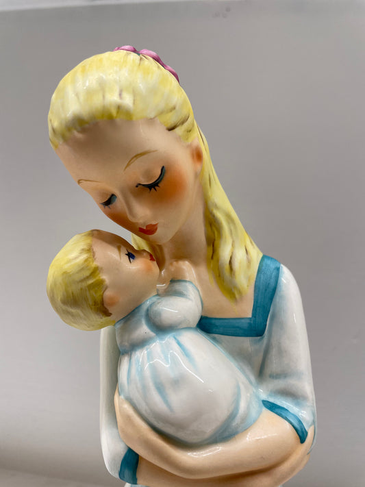 "Mother Embracing Child"