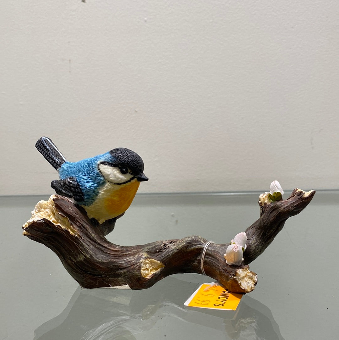 Bird Perching on Wood with Flowers