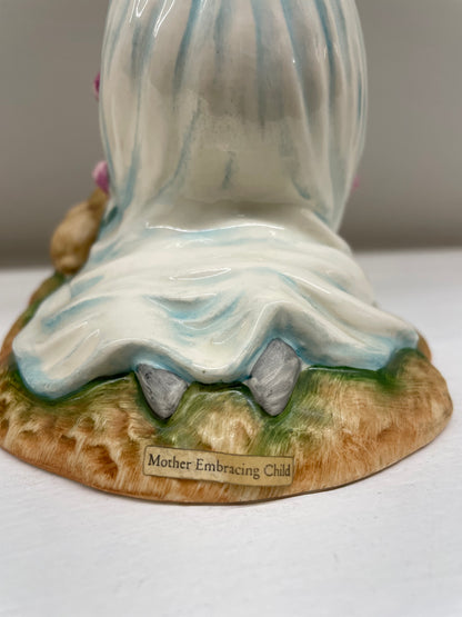 "Mother Embracing Child"